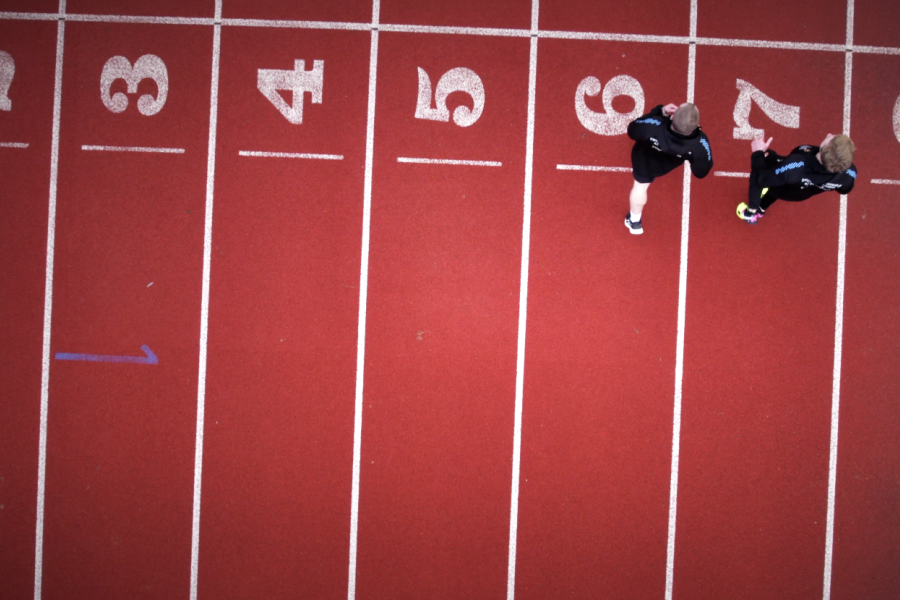 Two students running on the Treborth track