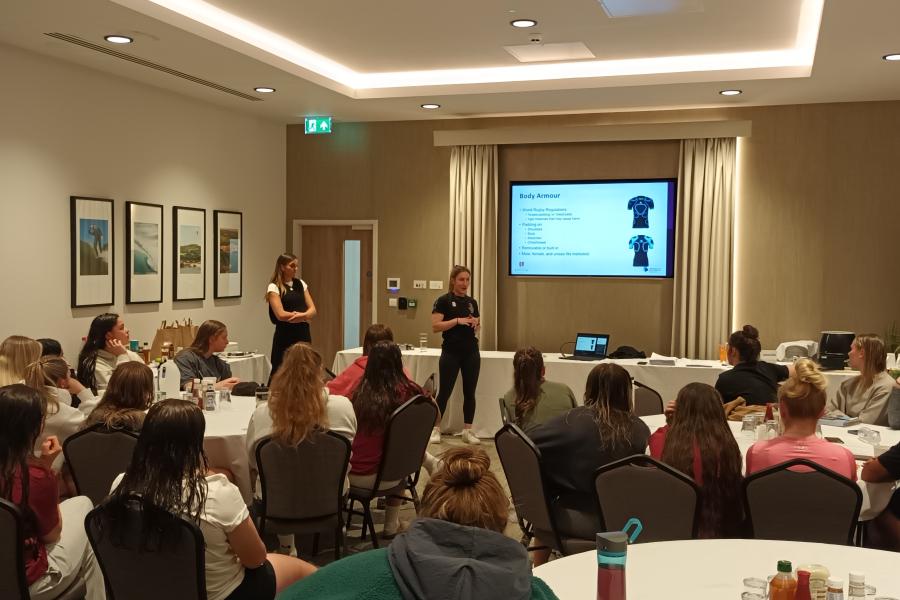 A room of young women taking part in a player welfare clinics at the U18 Six Nations in Colwyn Bay