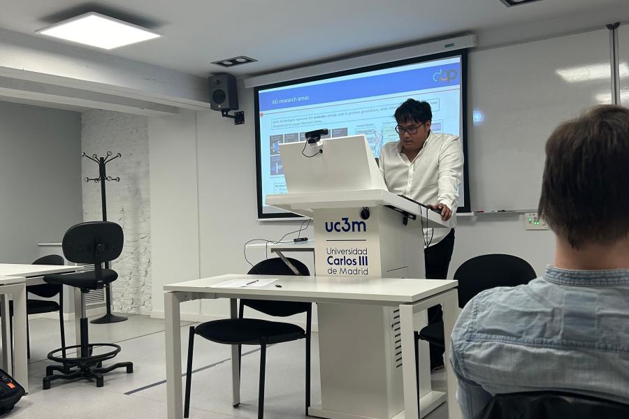 Postdoctoral researcher delivering guest lecture at Madrid University