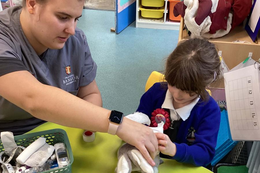 Medical Student participating in Teddy Bear Hospital in a local primary school