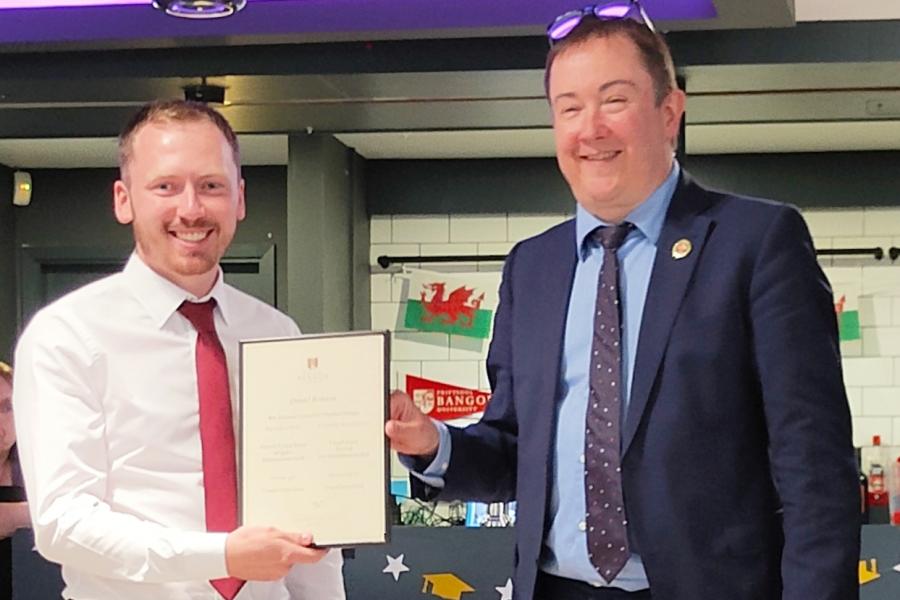 Daniel Roberts receiving the award