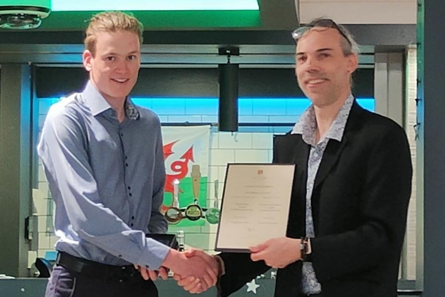 Gwion Roberts receiving his award