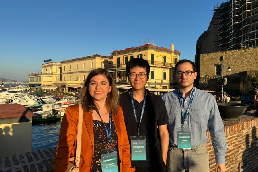 A photograph from the symposium, featuring Chiara, Cem, and Binru commemorates this successful event.