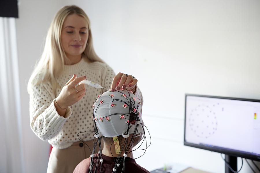 Student with brain cap