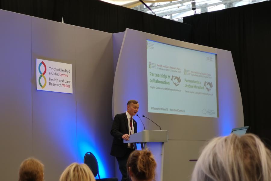 Man delivering speech at a conference