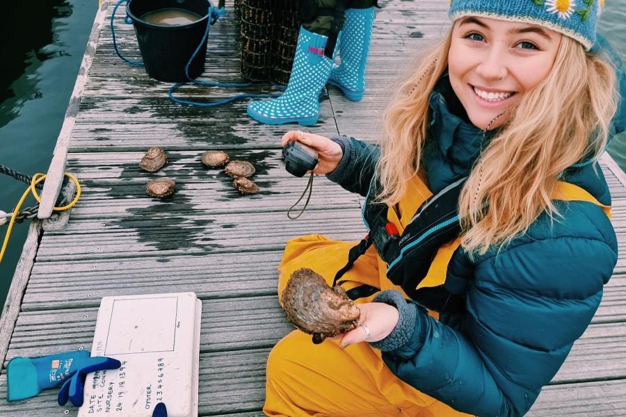Rhianna is documenting bivalves on a floating pontoon