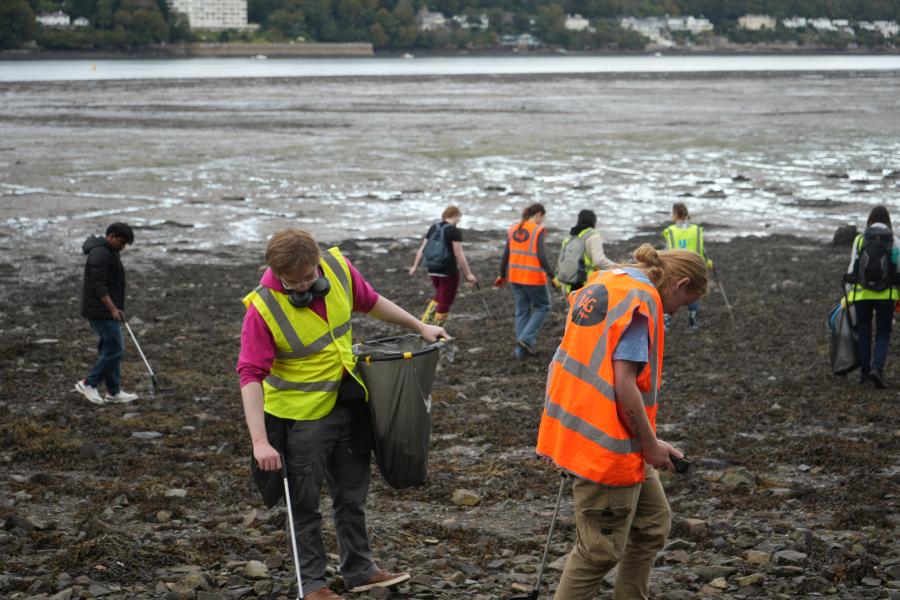 Student volunteers on a beach clean