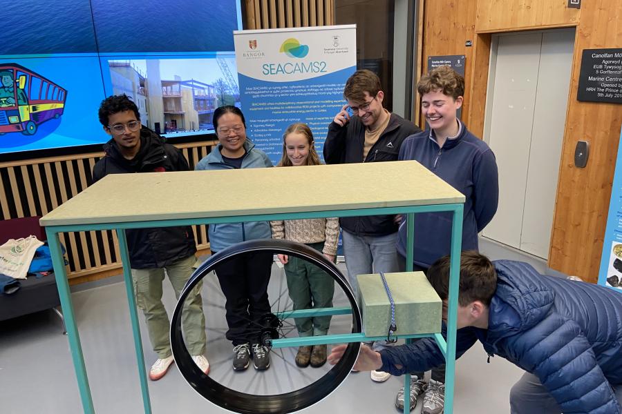 students trying out the wave machine