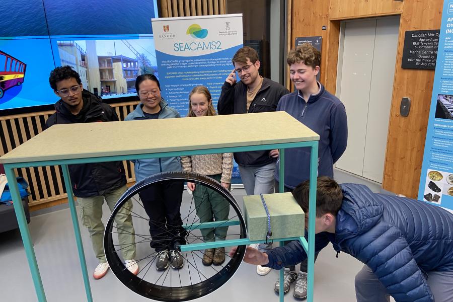 students trying out the wave machine