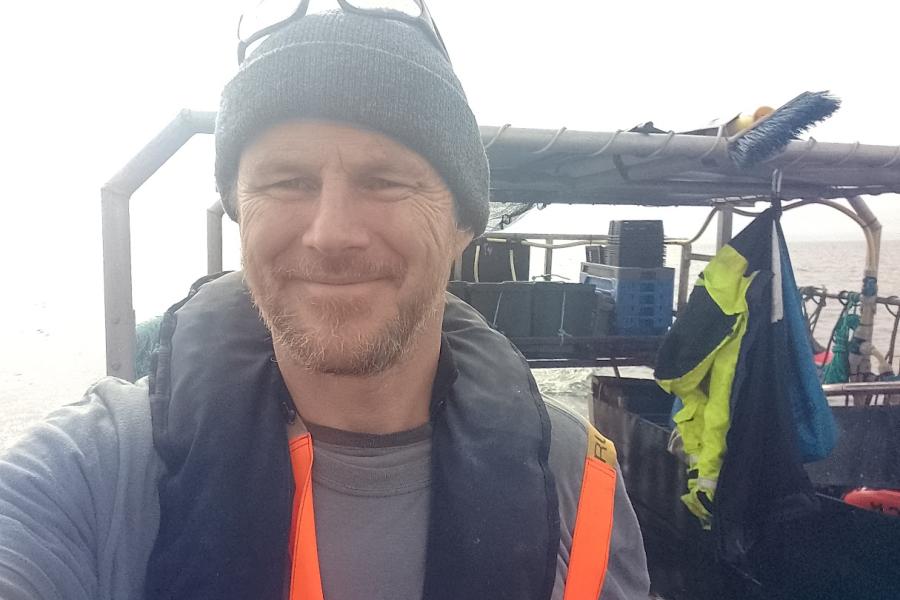 Dr Alec Moore onboard a research vessel at sea