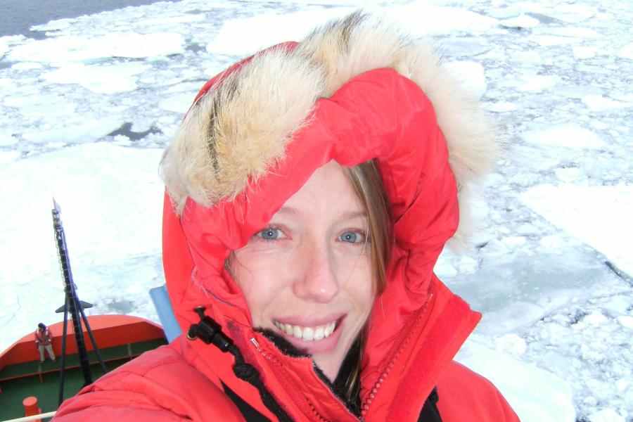 Dr Laura Grange onboard a research vessel in icy seas