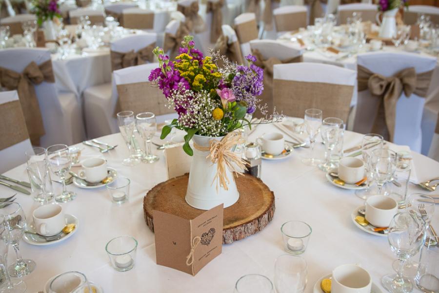 Hugh Owen Hall, set up for Wedding breakfast with flowers