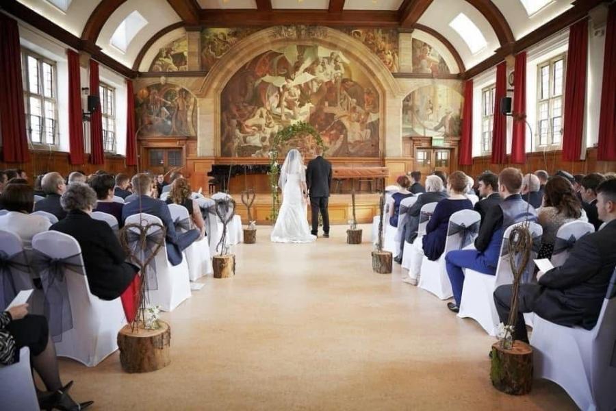 Image of Bride & Groom in Powis Hall about to get Married