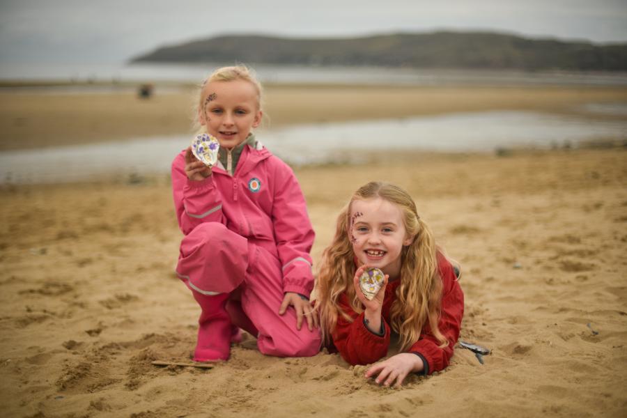 Community Celebration event- children holding painted oyster shells
