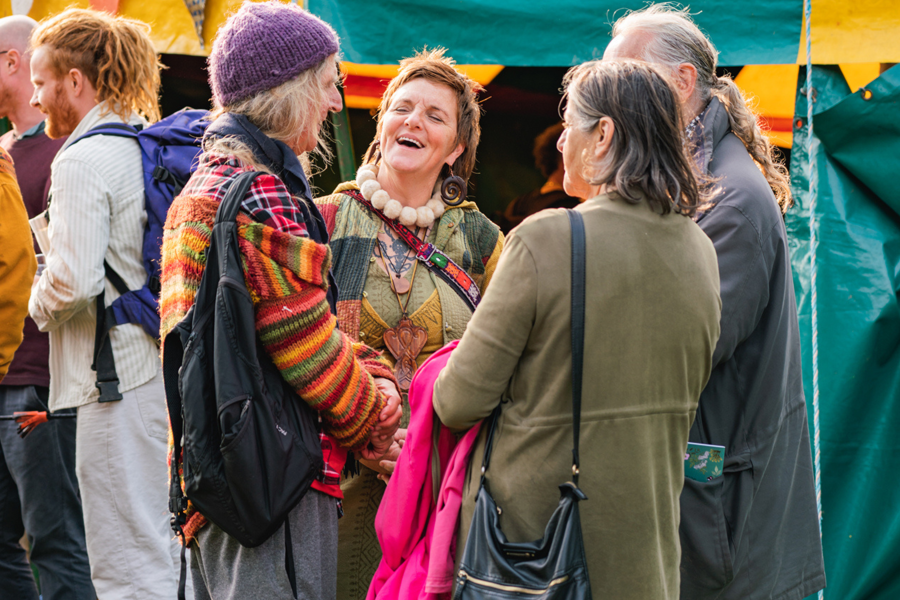 Small group of people chatting at a festival