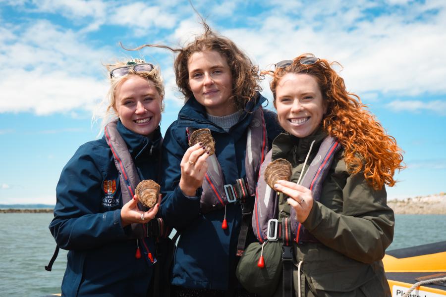 WOP staff holding native oysters 