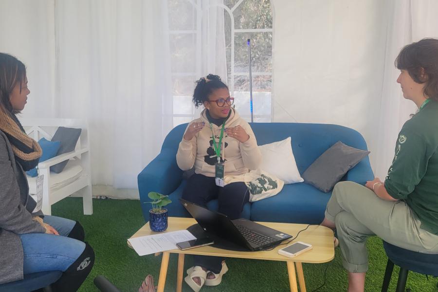 Photo of people in conversation at the symposium