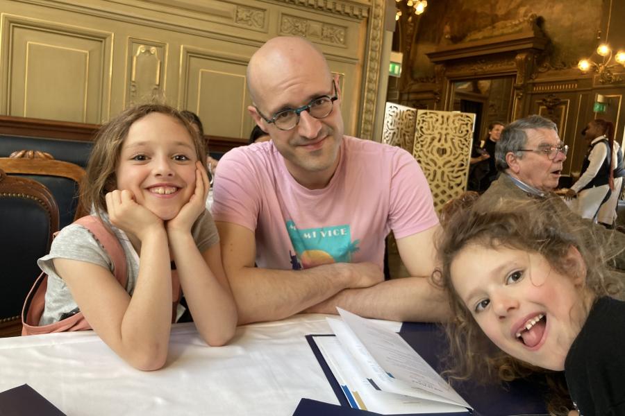 Dr Chris Saville with his two children, all looking to camera