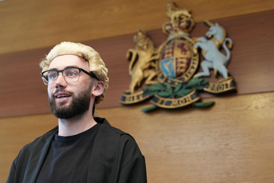 Law student practicing Mooting in the Moot Court at Bangor University