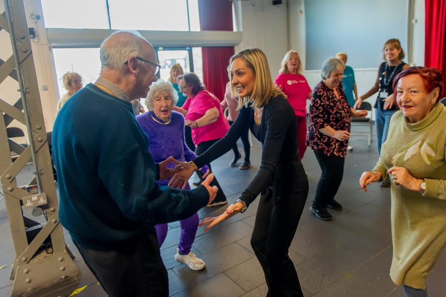 Professional Dancer Amy Dowden, Dance to Health Teacher Emma Jenkins and class participants.