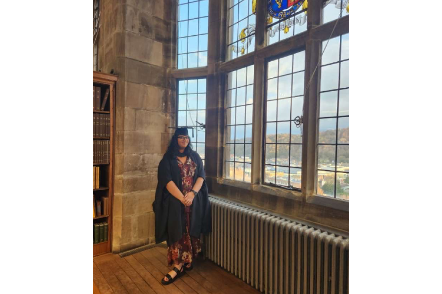 Emily on graduation day in the Shankland library 