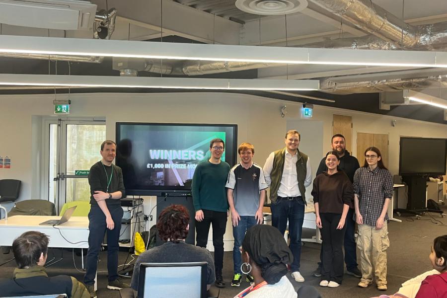 Computer Science Hackathon: First place team Sioned Owen (2nd-year Computer Science), Harry Polley (3rd-year Computer Science with Game Design), and Bryn Angell (3rd-year Computer Science with Game Design) who won the top prize of £1,000 for their solution, Carbon Pawprint