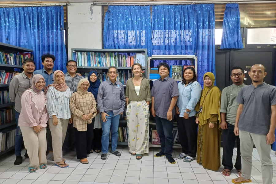 Hollie Booth standing with colleagues