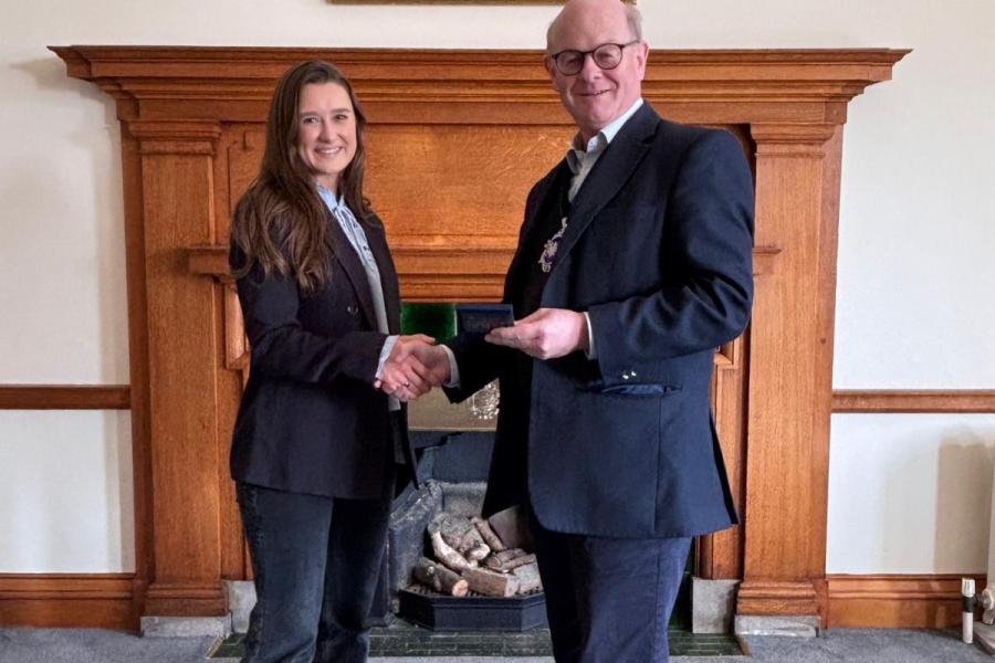 Lorna McKellar shaking hands with Master Draper Patrick Beddows