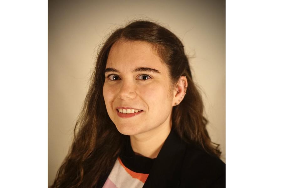 Image of Dr Tessa Davey on dark background