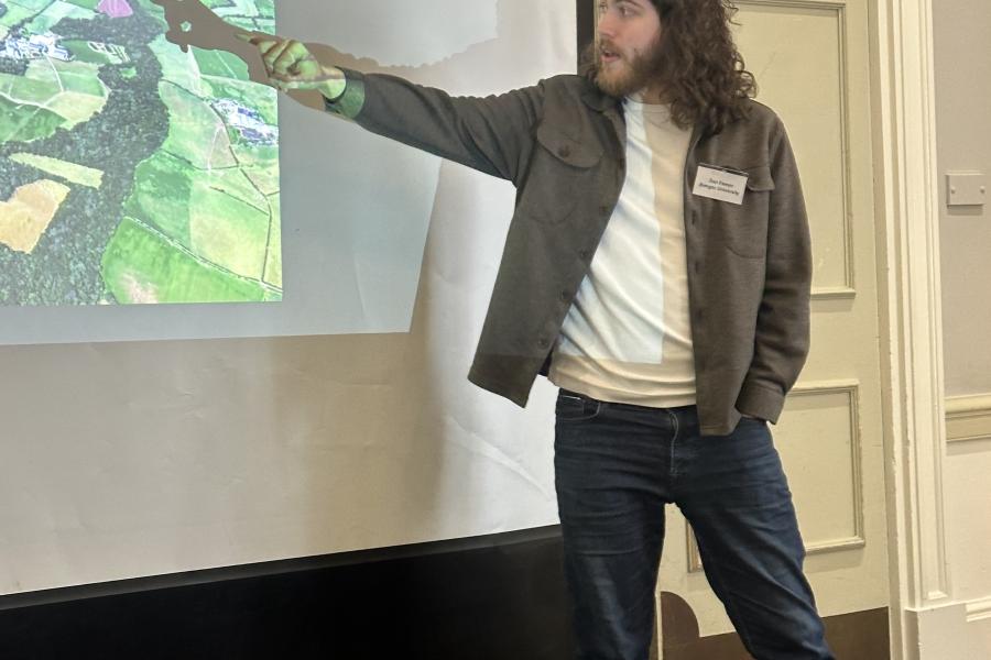 Daniel Farmer presenting at AIMLAC 2026