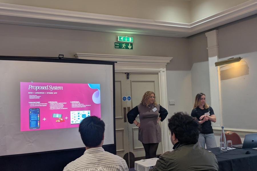 Rhiannon Owen and Shannon Jones presenting their work at AIMLAC 2026 conference