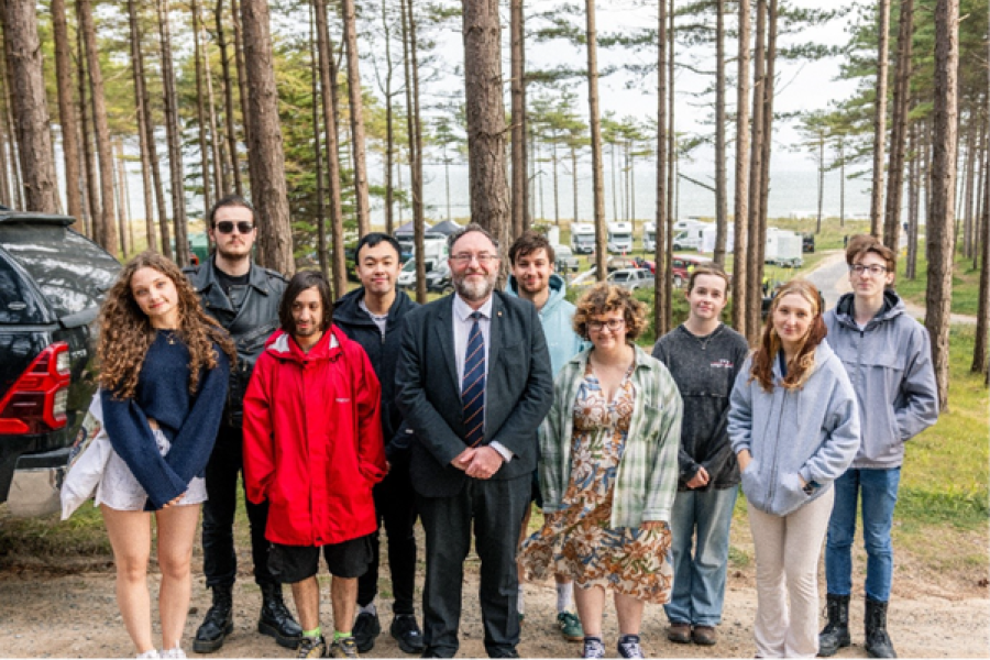 Professor Edmund Burke and students from the School of Arts, Culture and Language visiting the set at Llanddwyn