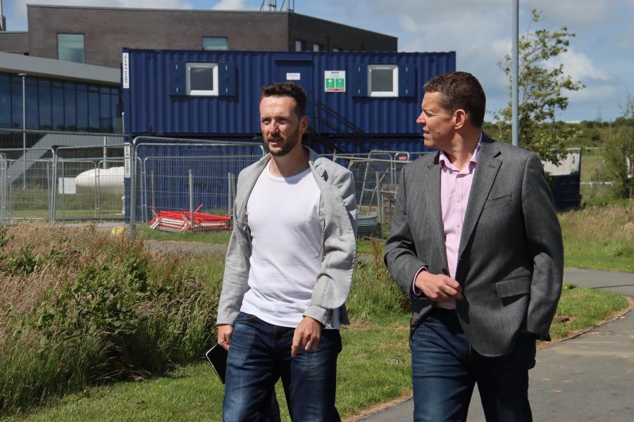 Pryderi ap Rhisiart MD MSParc with Welsh First Minister Rhun ap Iorwerth