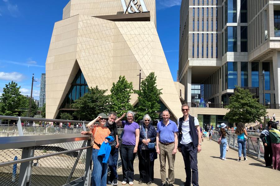 Group of alumni outside the V&A East building