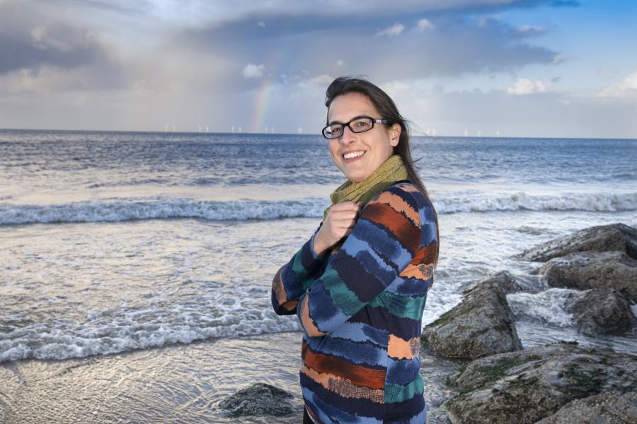 Person with sea in the background