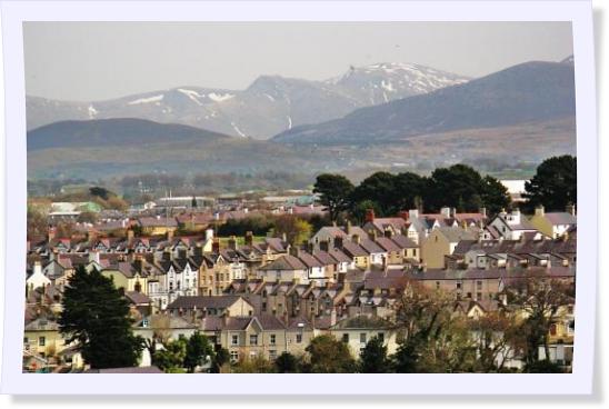 View over the rooftops of Caernarfon to the mountains