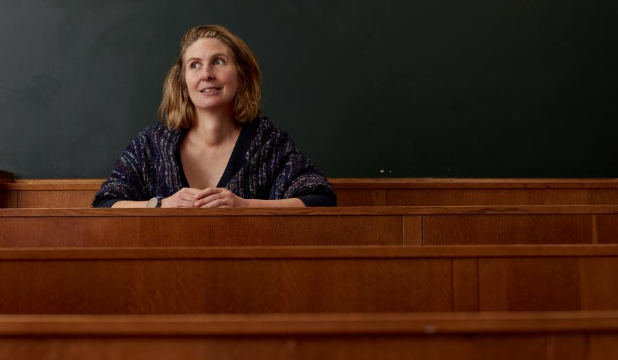 Professor sitting in lecture room