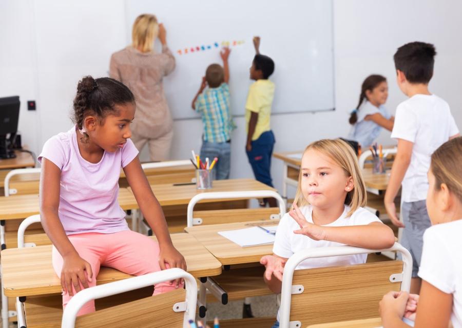 Children talking and working in a classroom