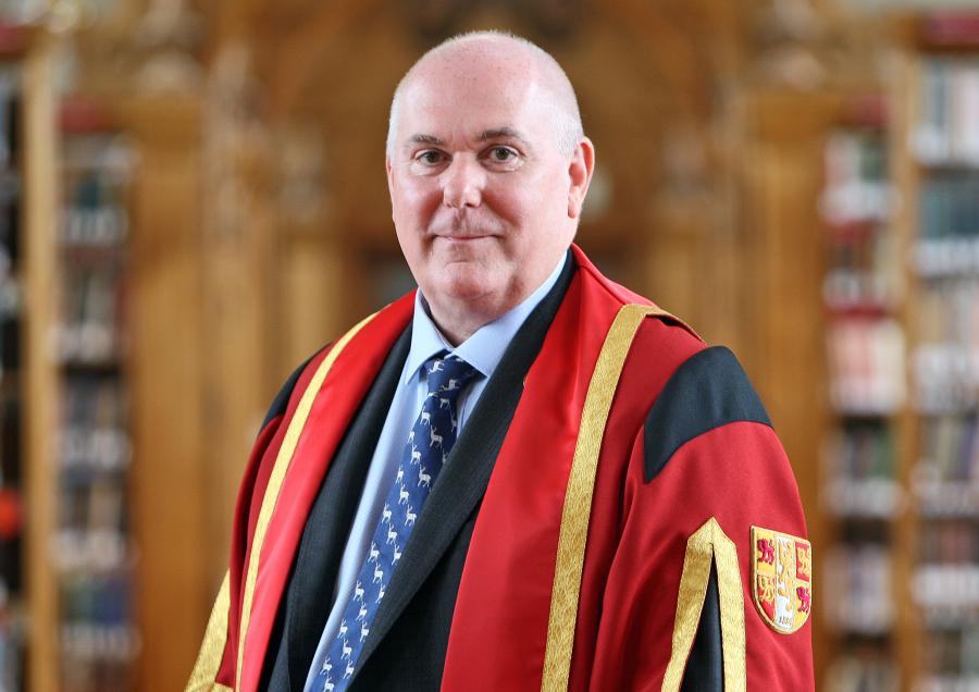 Simon Gibson in Bangor University gown in Shankland Reading Room