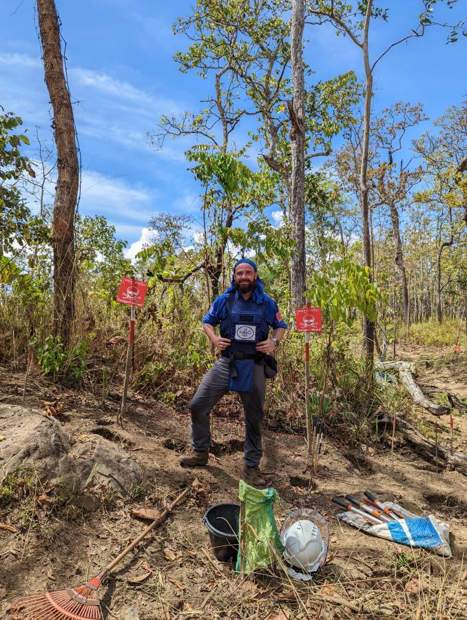 Alumni Richard Hughes working in a wooded area