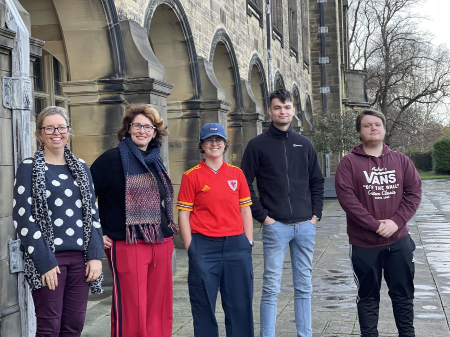 Picture showing Rhian Hodges, Mari Wiliam and students on the Teras outside the Main University Building