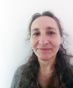 a portrait image of Dr Corinna-Patterson