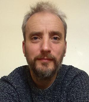 a portrait image of Dr Norman-Dandy
