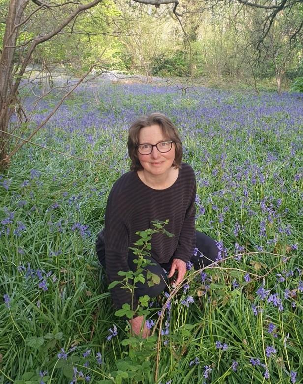 Rebecca Crane in a field of bluebells