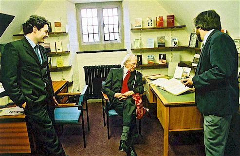 Professors chatting with R.S. Thomas