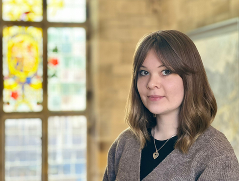 A close-up photograph of Sera Whitley in the Main Arts Building