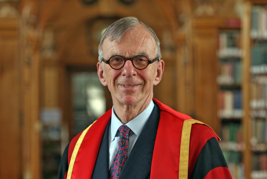 Photograph of Mr Richard Broyd OBE in Bangor University library in graduation gown