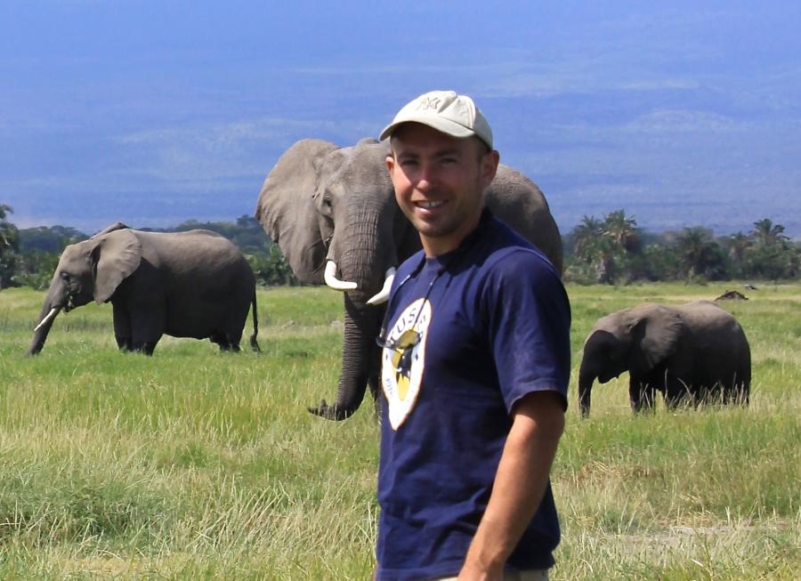 Dr Graeme Shannon with three elephants in the background