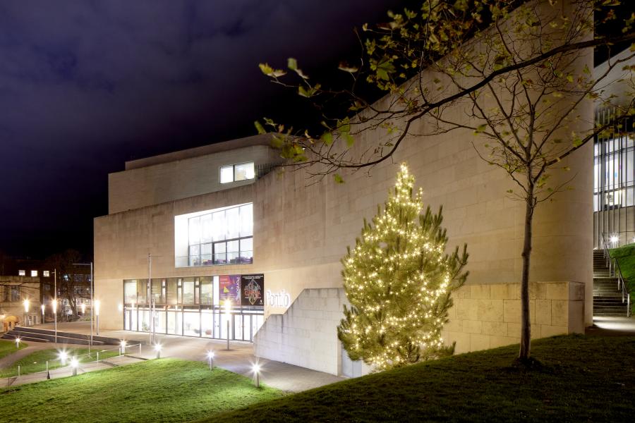 Pontio Arts Centre by night with Christmas tree 