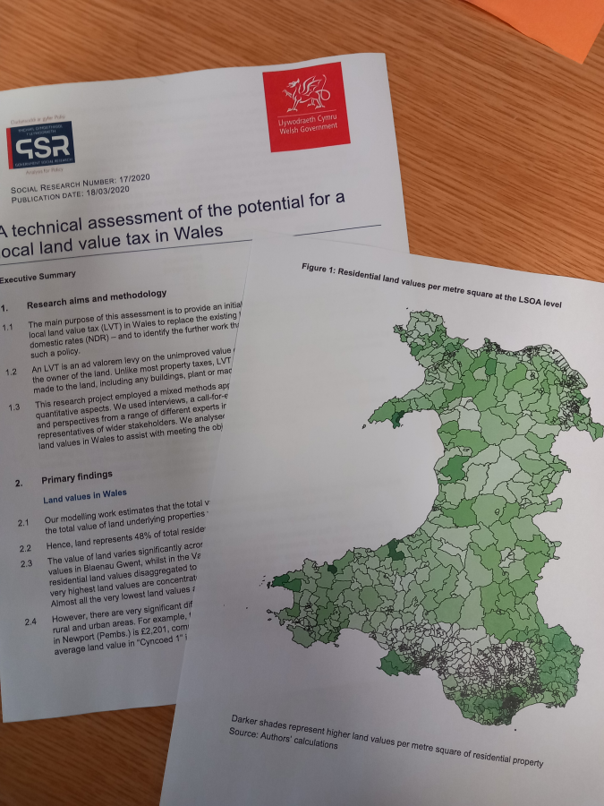 A image of the report on the table with a map of Wales.